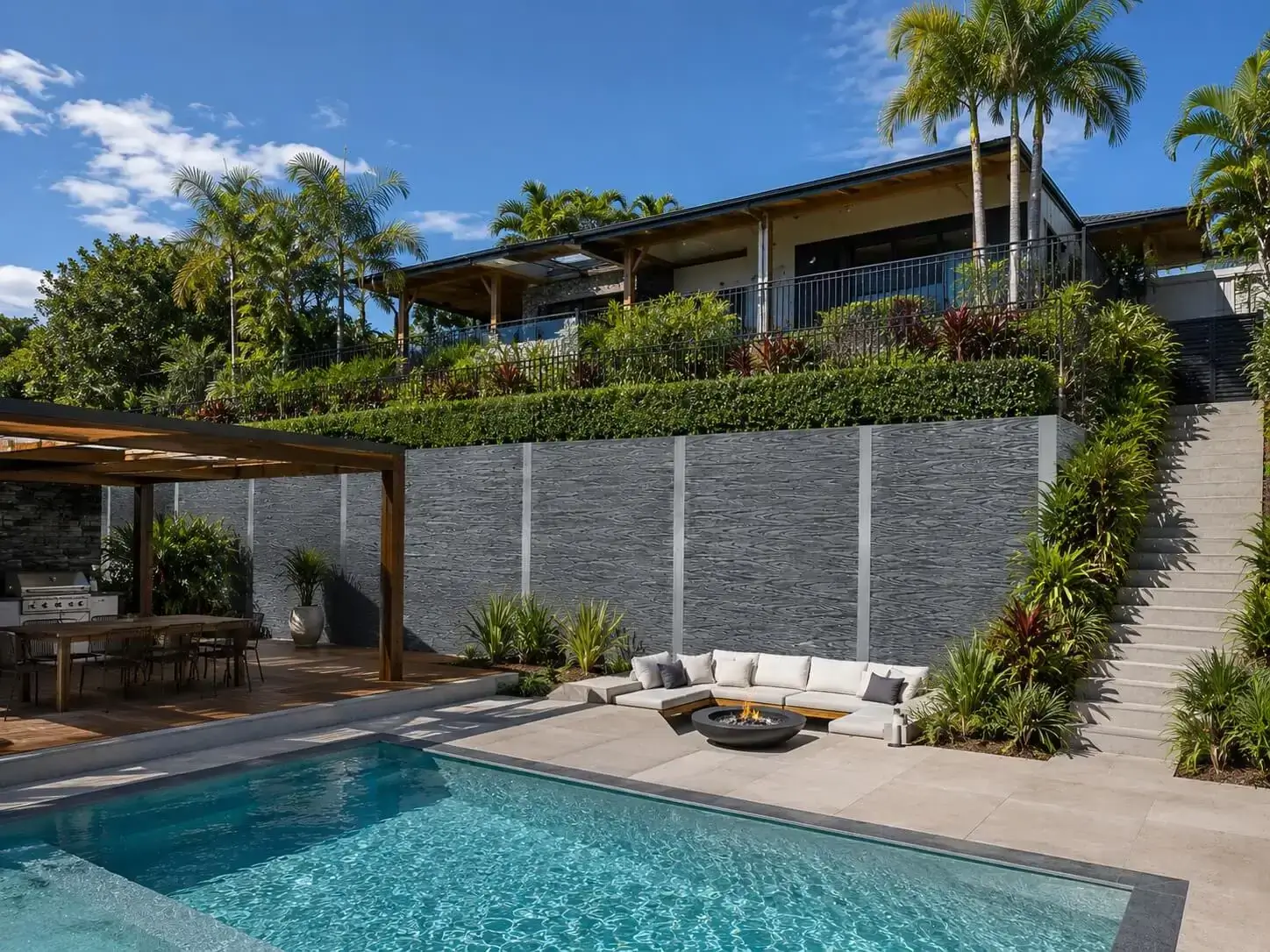 Ezzy Fit composite retaining wall installed in a landscaped property